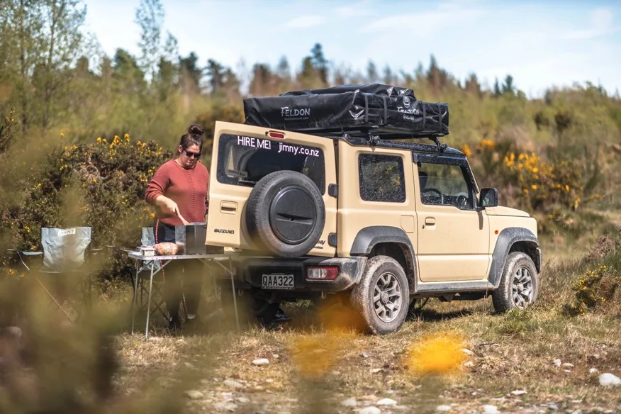 A Jimny Rentals hire vehicle set up at camp, from the founder's own fleet